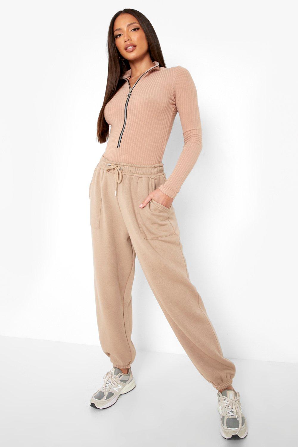 https://media.boohoo.com/i/boohoo/tzz96113_stone_xl_2/female-stone-tall-long-sleeve-zip-front-knitted-rib-bodysuit
