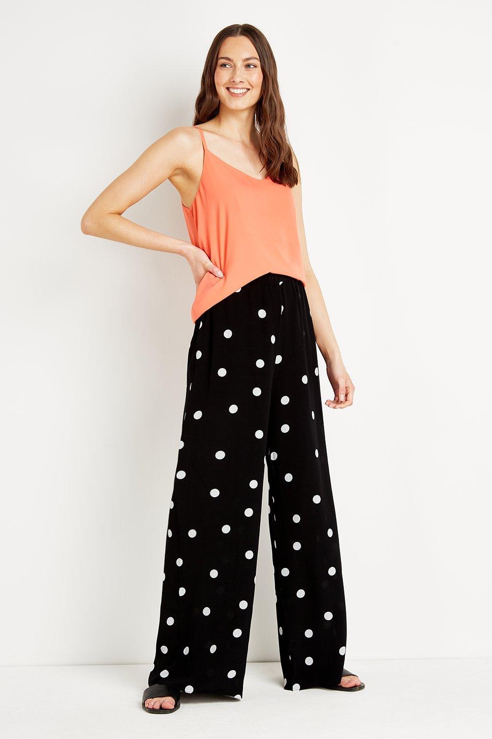 black pants with white dots