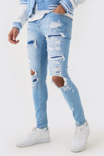 Brown Skinny Stretch All Over Rip Bleached Denim Jean In Light Blue