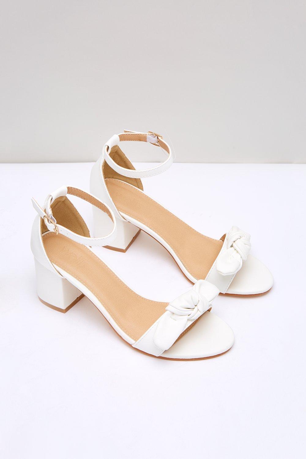 ladies cream low heeled shoes