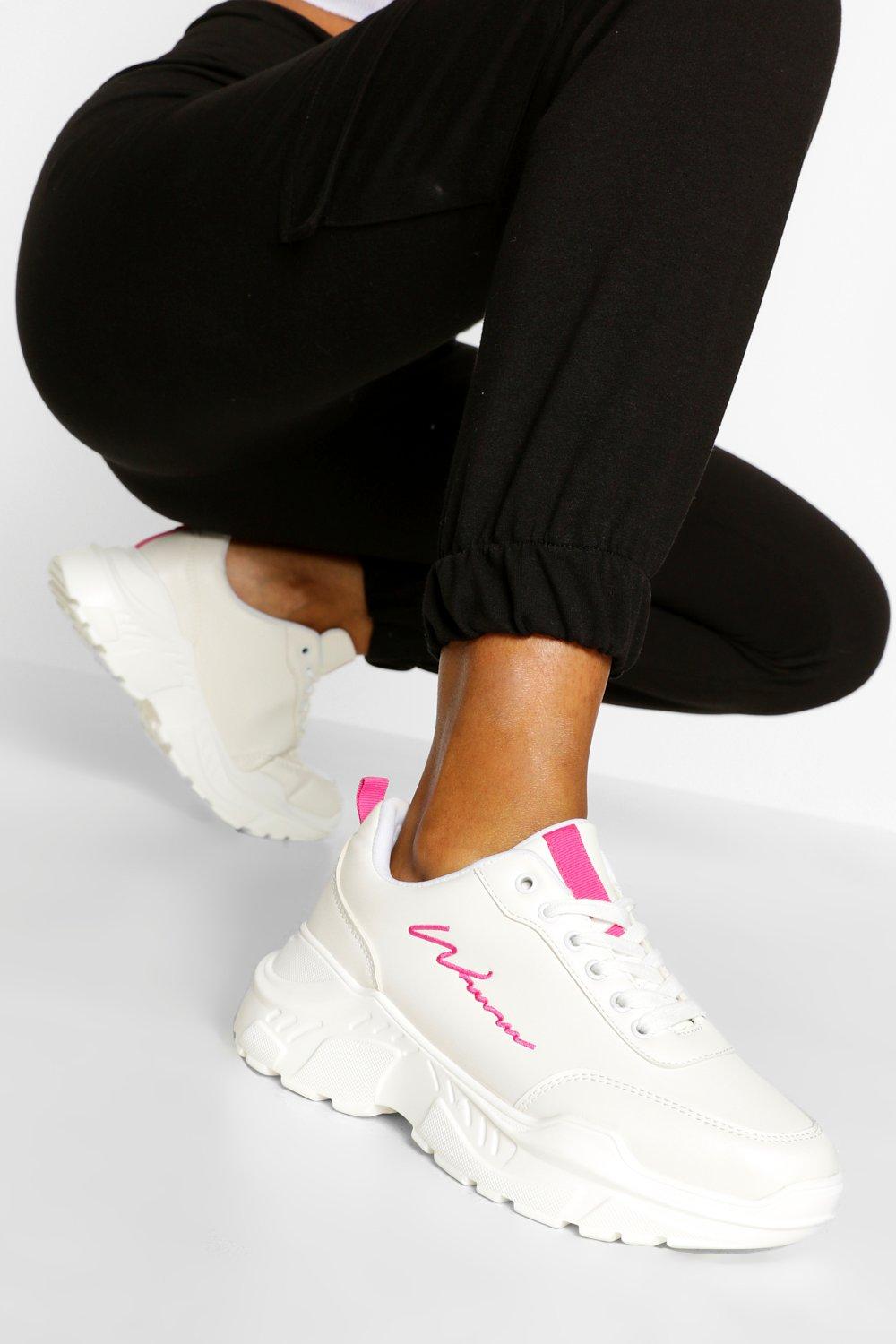 white and pink chunky trainers