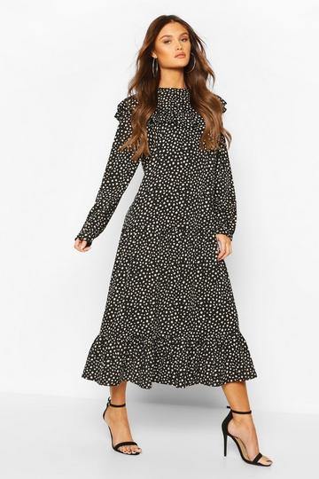 Robe mi-longue volantée à pois noir