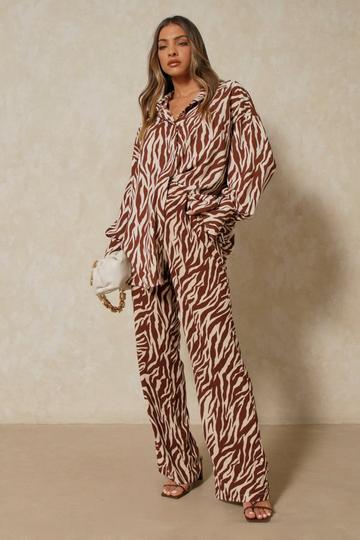 New Look zebra print flare pants in brown pattern